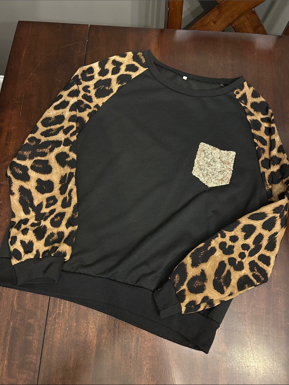 Black Sweatshirt with Leopard Raglan Sleeves and Sequin Pocket
